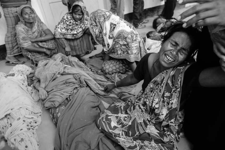 A woman mourns over a relative who died in the Rana Plaza building collapse, in Savar, Bangladesh, April 24, 2013.