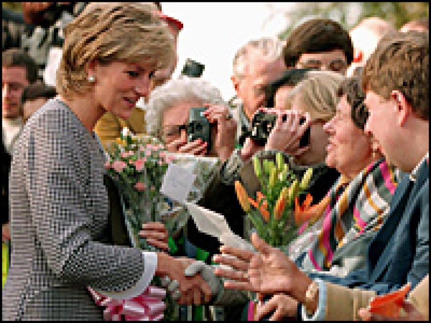 Princess Diana greets members of the public before opening the Foundation for Conductive Education for the disabled in October 1995 in Birmingham, England.