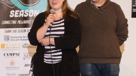 Rose Burrell, accompanied by spouse Nate and guide dog Pierce, at the Tales from Milwaukee Story Slam, March 2025.