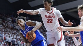 Kentucky center Amari Williams (22) rebounds the ball with pressure from Alabama forward Aiden Sherrell (22) during the second half of an NCAA college basketball game, Saturday, Feb. 22, 2025, in Tuscaloosa, Ala. (AP Photo/Vasha Hunt)