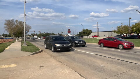 Cars travel southbound on North Lincoln Boulevard, east of Interstate 235.