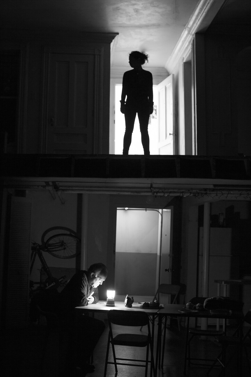 Even the play's set evokes fear, with weird noises and shadows, and the lights go out one by one. (Pictured: Sarah Steele, Reed Birney)