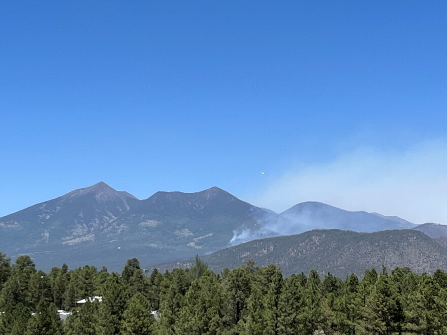 A DC10 circles above the Pipeline Fire on the San Francisco Peaks before making a fire retardant drop on the south facing flanks on Tue, June 14, 2022.