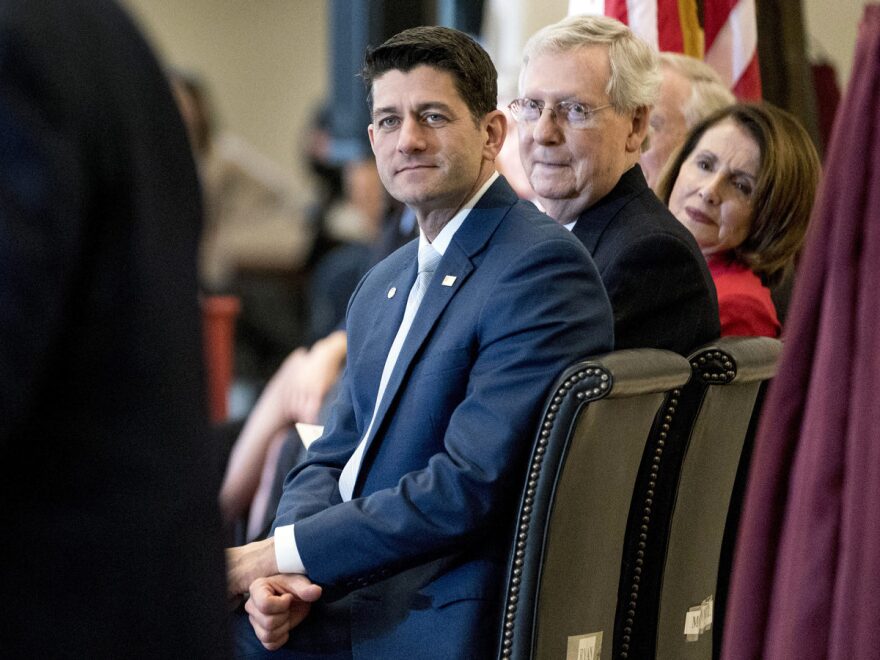 From left, House Speaker Paul Ryan of Wisc.,, Senate Majority Leader Mitch McConnell of Ky., and House Minority Leader Nancy Pelosi of Calif. appear for a Congressional Gold Medal Ceremony honoring the Office of Strategic Services in the Capitol on March 21, 2018. Hours later, congressional leaders agreed to a $1.3 trillion spending package.