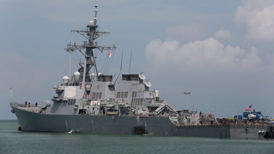 The guided-missile destroyer USS John S. McCain is moored pier side at Changi naval base in Singapore.