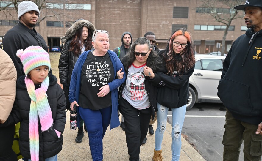 La'Niyah Clark's grandmother, Sabrina Smith, leans on friends outside the Wilkes-Bare