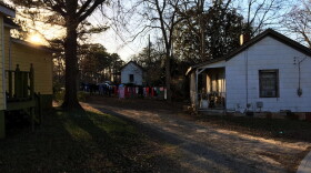 The sun sets on the Rose Hill neighborhood of Porterdale, Georgia. These homes were built in the early 20th century for African-American workers at the nearby cotton mill.
(Sam Whitehead/GPB)
