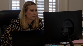 Lacey Thompson, a criminal defense attorney with an office in Columbia, works at her desk.