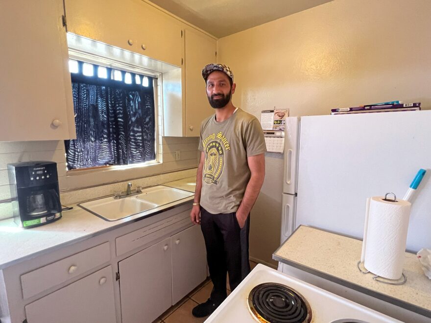 Abdul Rab Noori stands in the kitchen of his Las Cruces apartment March 17, 2022.