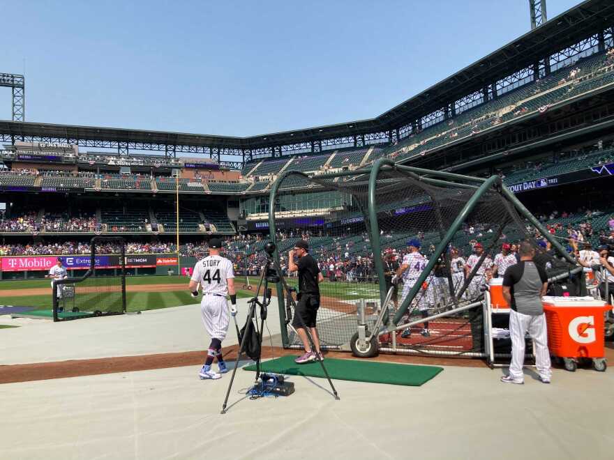 Colorado Rockies Trevor Story waits on deck to practice for the Home Run Derby behind Mets first baseman Pete Alonso on July 12, 2021.