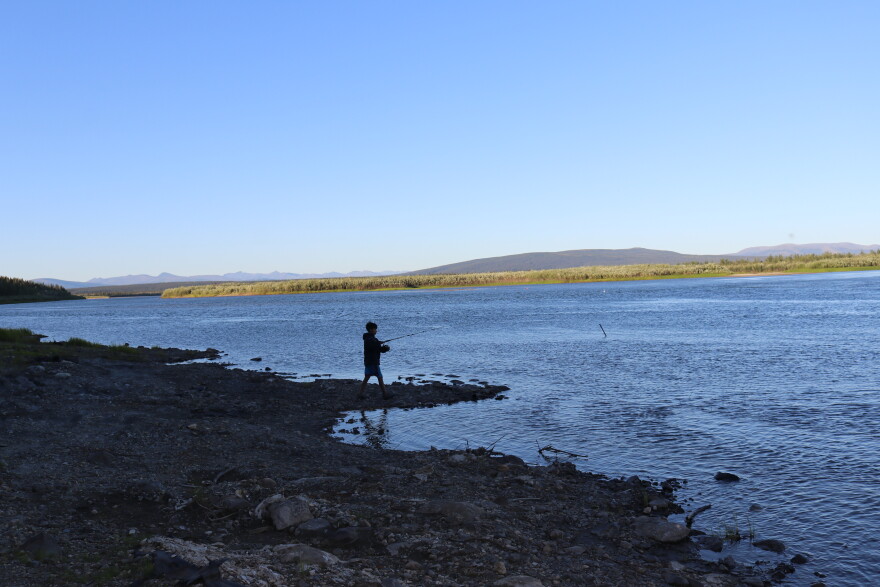 A boy fishes for salmon and sheefish along the Kobuk River near Ambler on July 24, 2026. Many opponents of mining in the Upper Kobuk region cite concerns about the potential effects of mining on subsistence activities.