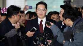 J.Y. Lee, vice chairman of Samsung Electronics, arrives at the office of the independent counsel last Thursday in Seoul, South Korea. Prosecutors are now seeking an arrest warrant for Lee.