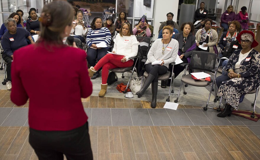 Anita Earls, a candidate for the North Carolina Supreme Court, talks with a group of black women during a Sister to Sister salon conversation at the Chesterfield in Durham on Friday, October 26, 2018. 