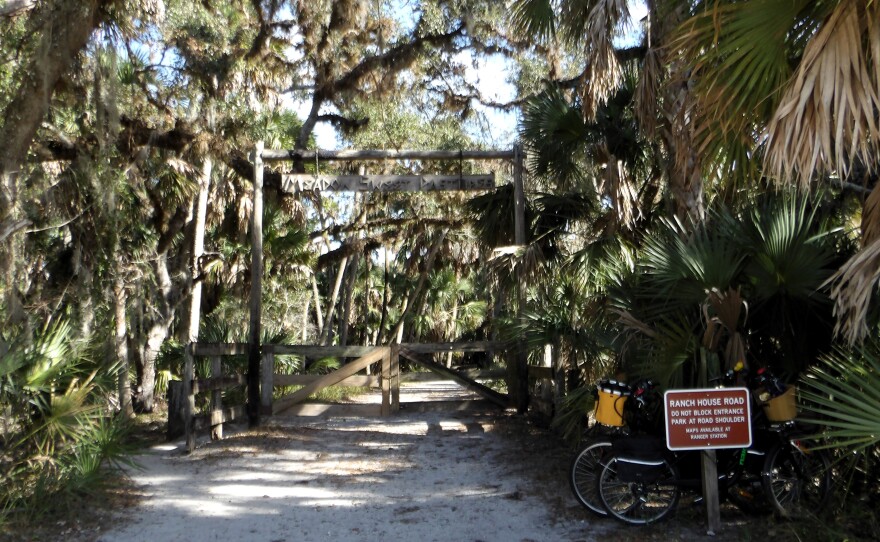 Entrance to a state park closed by a gate