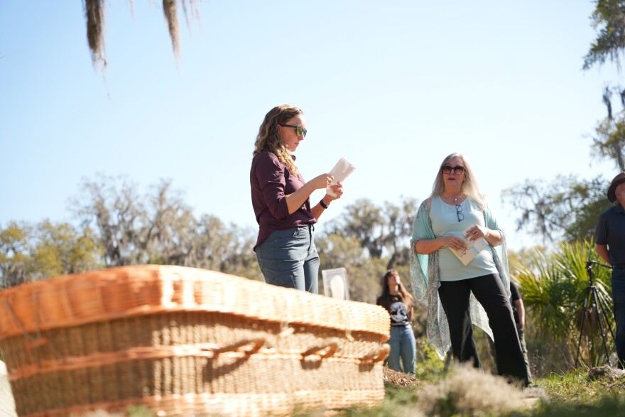 A member of the James family reads a piece prepared for the service. Families are allowed time to celebrate their loved ones. (Alexis Vivanco/WUFT News)