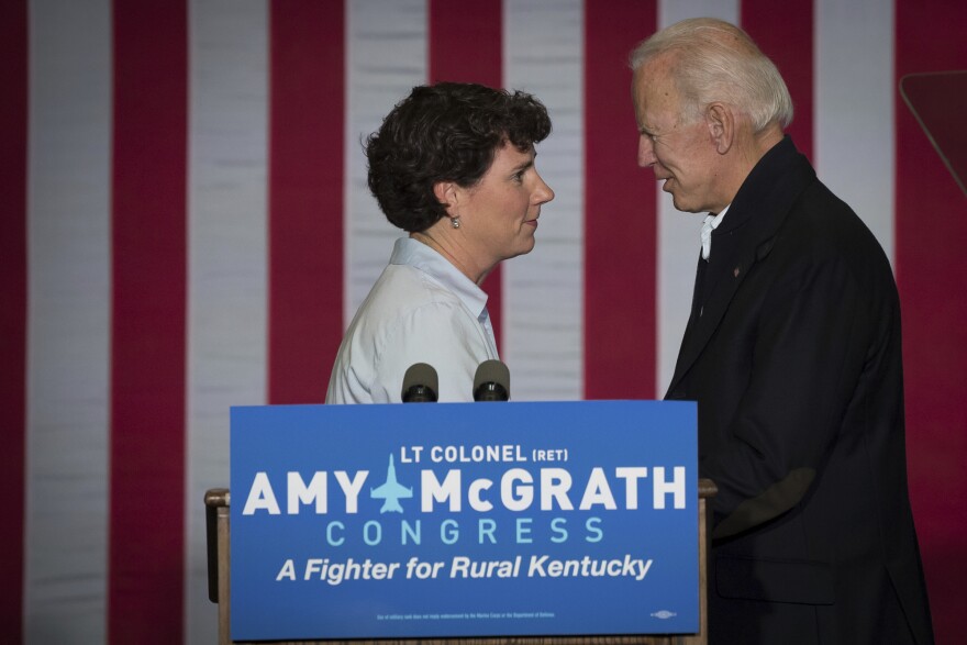 Former Vice President Joe Biden and democratic congressional candidate Amy McGrath shake hands during a campaign event in Owingsville, Ky., Friday, October 12, 2018.