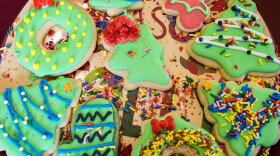 Decorated christmas sugar cookies with sprinkles and royal icing.