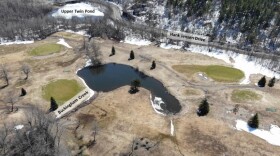 Overhead photo of a golf course with two bodies of water labeled