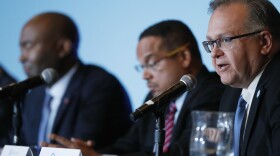 Ray Buckley, front, chair of the Democratic Party of New Hampshire, addresses a forum on the future of the Democratic Party, featuring candidates running to be the the next chair of the Democratic National committee. (David Zalubowski/AP)