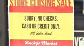 A store closing sign at Lucky's Market in Bloomington.