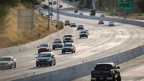 Cars move along I-80 at dusk under the 1300 E overpass in Sugar House, Salt Lake City, Aug. 14, 2026.