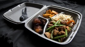 A styrofoam container is shown with take out food at a restaurant in Washington, Thursday, Dec. 31, 2015.