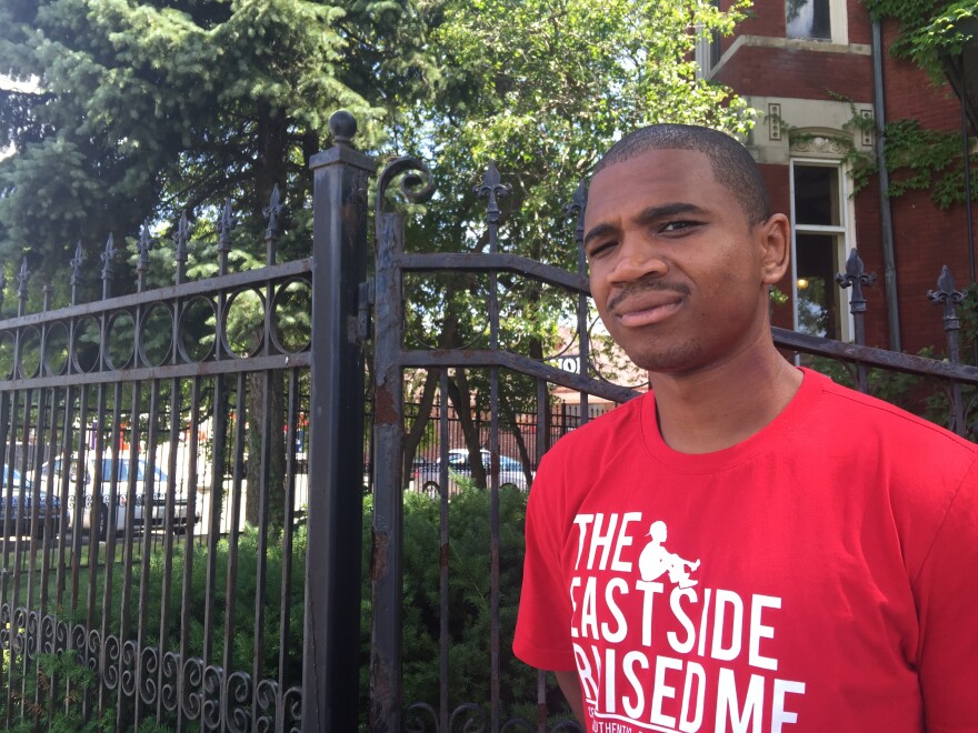 Davontae Sanford is wearing a red t-shirt with the words "The Eastside Raised Me" written in white lettering. 