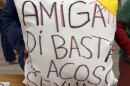 A member of Líderes Campesinas holds a pillow she decorated at one of the group’s meetings. It says, “Friend, say that’s enough to sexual harassment.”