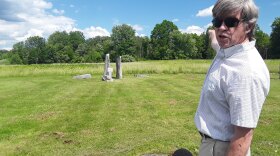 Astronomer Stephen Schneider stands in the middle of the UMass Amherst sunwheel, explaining how a solstice actually lasts more than one day.