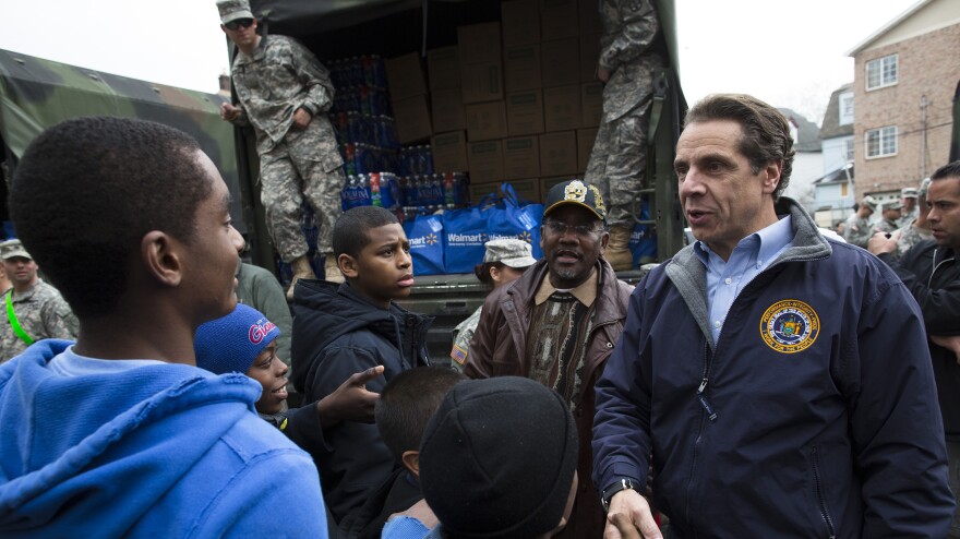 New York Gov. Andrew Cuomo meets Nov. 10 with residents of the Far Rockaways section of Queens, which was hit hard by Hurricane Sandy. Cuomo is seeking $30 billion in federal assistance to help rebuild his state at a time when Congress is already consumed with reducing the deficit.