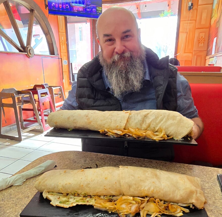 KCUR contributor Shannon Carpenter tackles the burrito challenge at The Corner Mexican Food Restaurant in Kansas City.