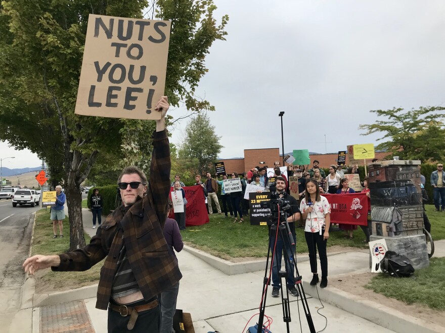 Andy Smetanka holds a sign protesting the closure of Montana's only alternative weekly newspaper.