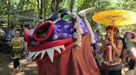 A puppet shaped like a dragon. 