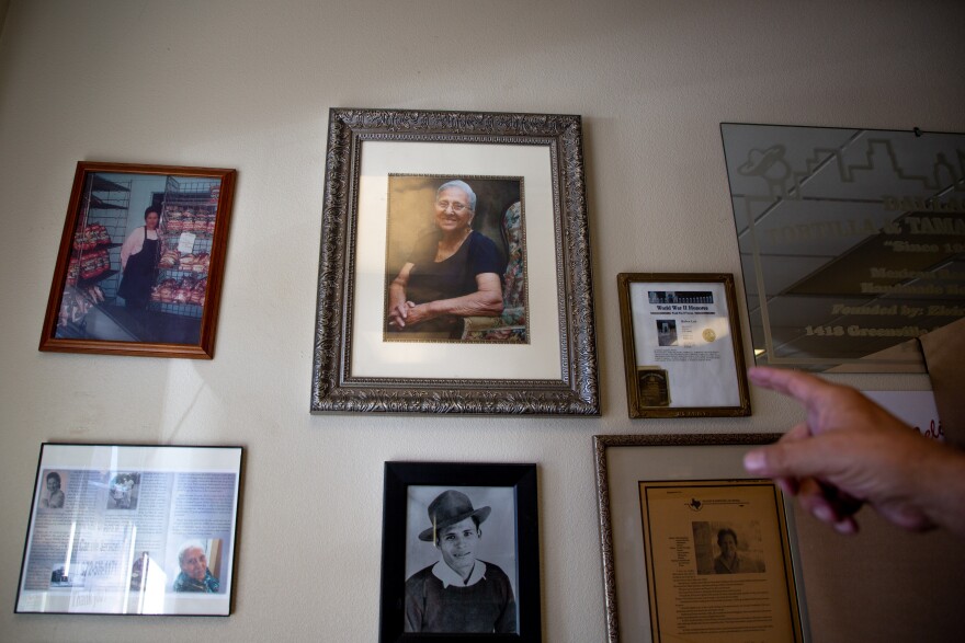 An assortment of photos and frames hang on the main wall of the shop. A photo of Elvira Leal, the founder of Dallas Tortilla and Tamale Factory, is front and center.