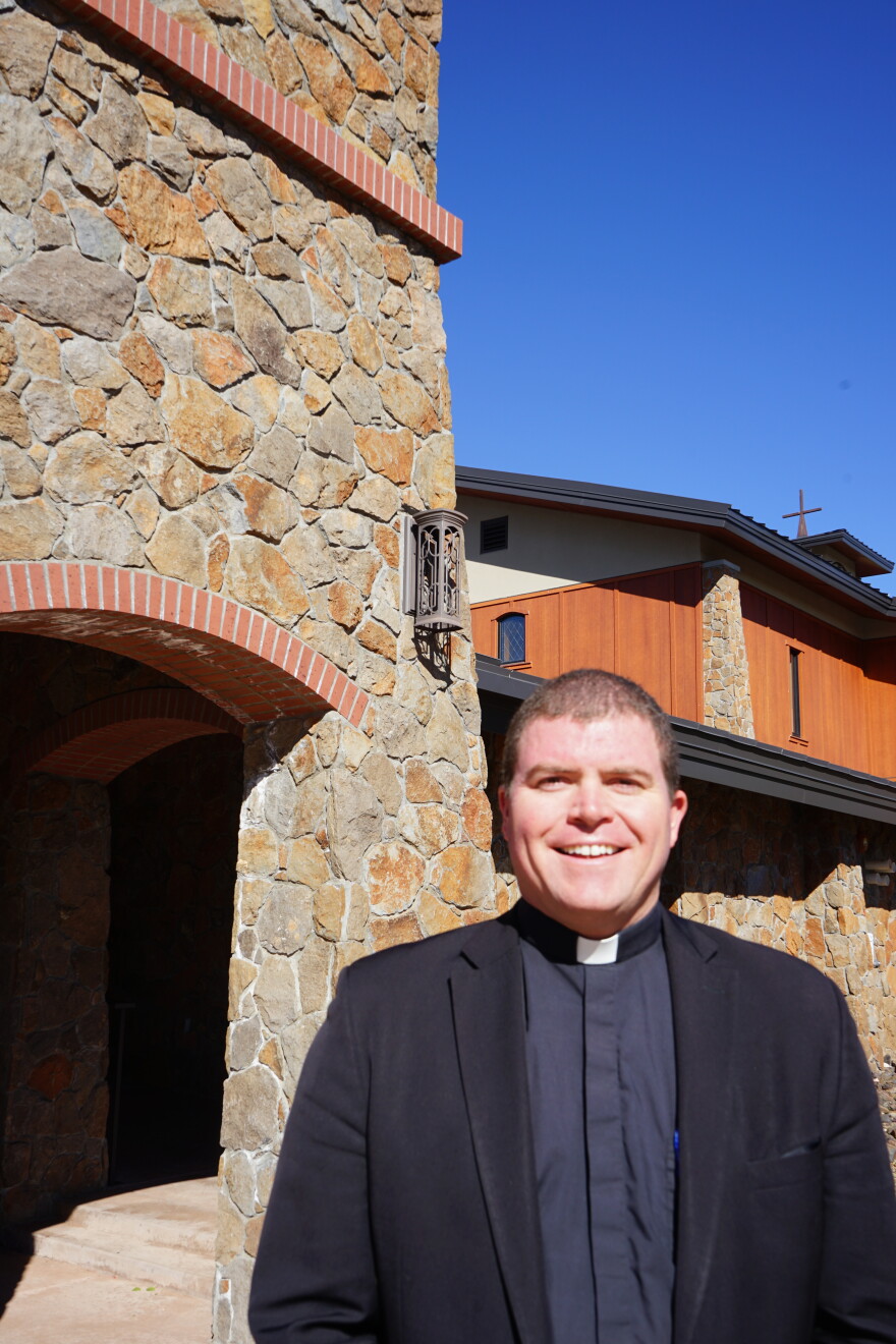 Father Daniel Connealy poses outside of Flagstaff’s San Francisco de Asís Catholic parish in October of 2026.