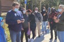  A representative with the Florida Department of Health Duval County explains to those in line at Cuba Hunter Park COVID testing site that they are short staffed and reinforcements are coming from another site to help them.