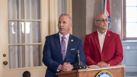 State Sen. Rick Brattin, a Republican from Harrisonville, and Secretary of State Denny Hoskins speak to reporters outside Hoskins's office in the Missouri State Capitol Tuesday. The press conference also drew in LGBTQ+ advocates who criticized the two officials for attacks on a "rainbow story time" held in Columbia Saturday.