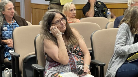 City of Alachua residents who studied the agenda expressed concern about the verbiage of the ordinance on data centers. (Dulce Rodriguez-Escamilla/WUFT News)