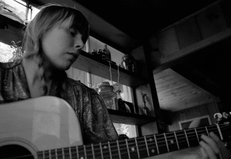 Mitchell at her home in Los Angeles around 1970 when she was writing many of the songs that would eventually appear on <em>Blue</em>.
