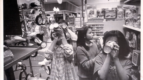 Hmong children May Lee, Za Vue, Pat Saysamone, Zoua Her are shown in a toy store at Merced Mall, 1986.