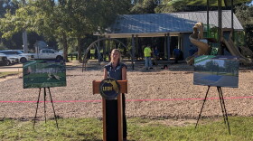 Leon County Parks and Recreation Director Amanda Heidecker makes remarks in front of the half-court basketball space now under construction at the Tower Road Park.