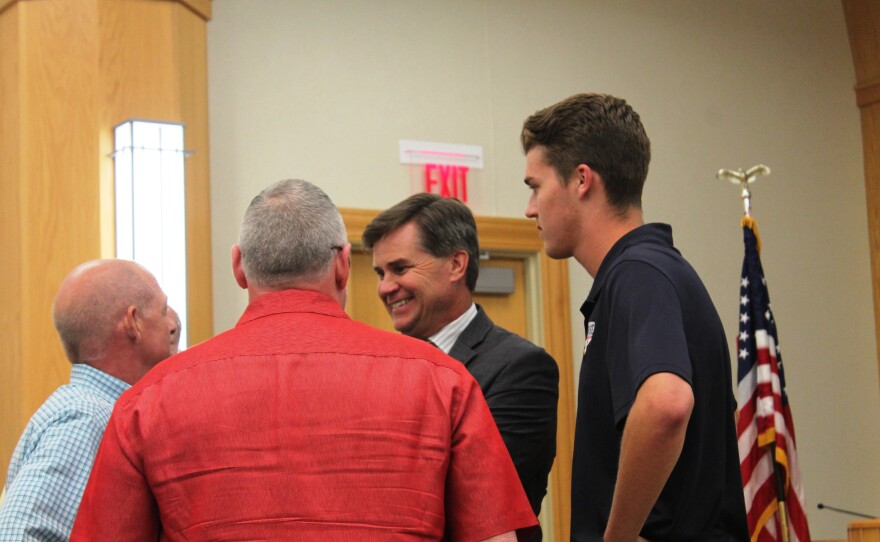 Dan Buck, center, and his son Quinn, right, talk to supporters of Buck's POWERplex development on Monday, June 5, 2017, after Chesterfield officials announced the deal to build the $55 million facility was dead.