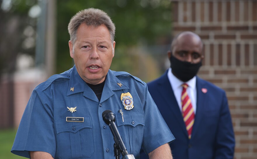 Kansas City Police Chief Rick Smith speaks at a podium with Kansas City Mayor Quinton Lucas standing behind him at an Operation LeGend update in September last year.