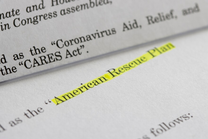 Some papers with the words "American Rescue Plan" highlighted