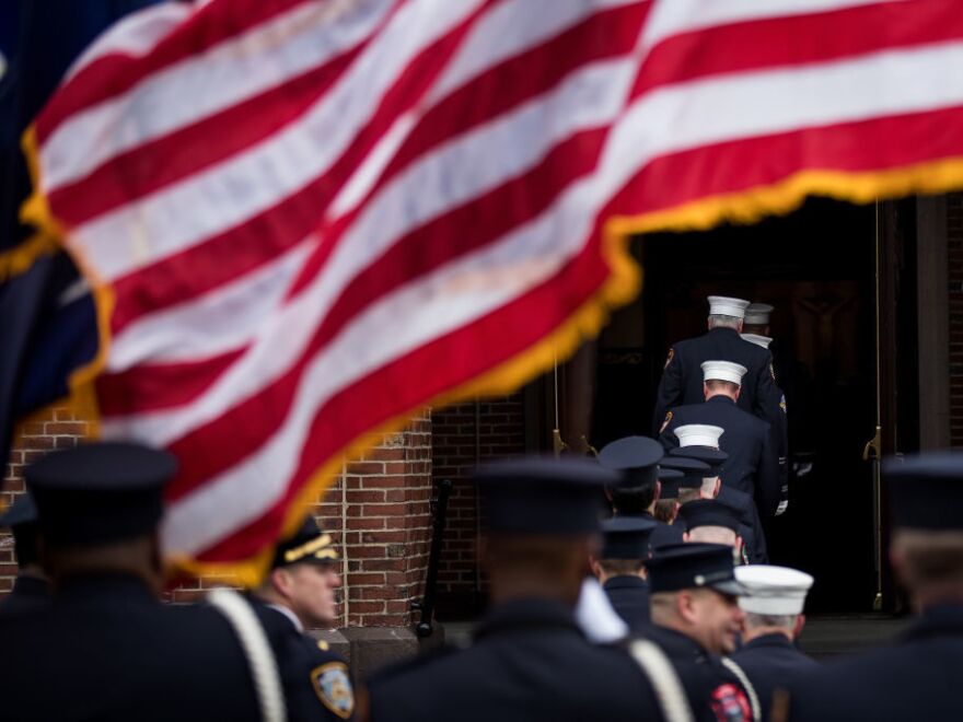 Members of the New York City Fire Department honor firefighter Thomas Phelan at his funeral in Brooklyn March 20, 2018. Phelan worked as a Statue of Liberty ferry boat captain, helping to evacuate thousands of stranded citizens from Lower Manhattan during the 9/11 attacks and died of cancer believed to be related to his exposure to the toxic fumes around ground zero.