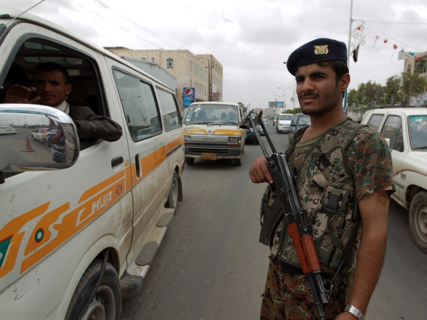 A Yemeni soldier stands guard Tuesday near Sanaa International Airport.