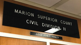 The plaque above a Marion County Superior Court which issued an injunction, ordering the state to keep federal unemployment benefits in Indiana.