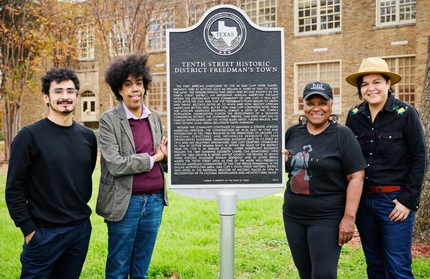 Standing alongside the historical marker for the Tenth Street Freedman's Town are (l to r) filmmaker Christian Vazquez, playwright Jonathan Norton, artist-curator Vicki Meek and Ángel Faz, artist and activist. The four are collaborating on a Nasher Sculpture Center project to mark or memorialize the historic district in some way.