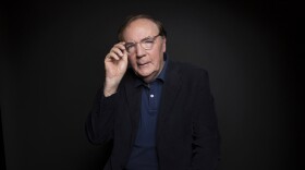 FILE - Author James Patterson poses for a portrait in New York on Aug. 30, 2016.