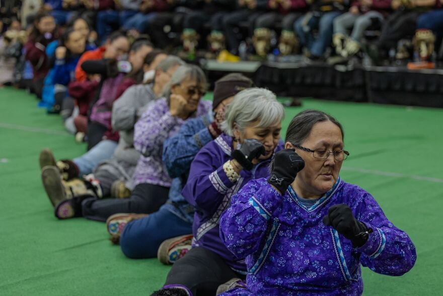 The North Slope Borough Mayor's Office performs a song during Kivgiq.